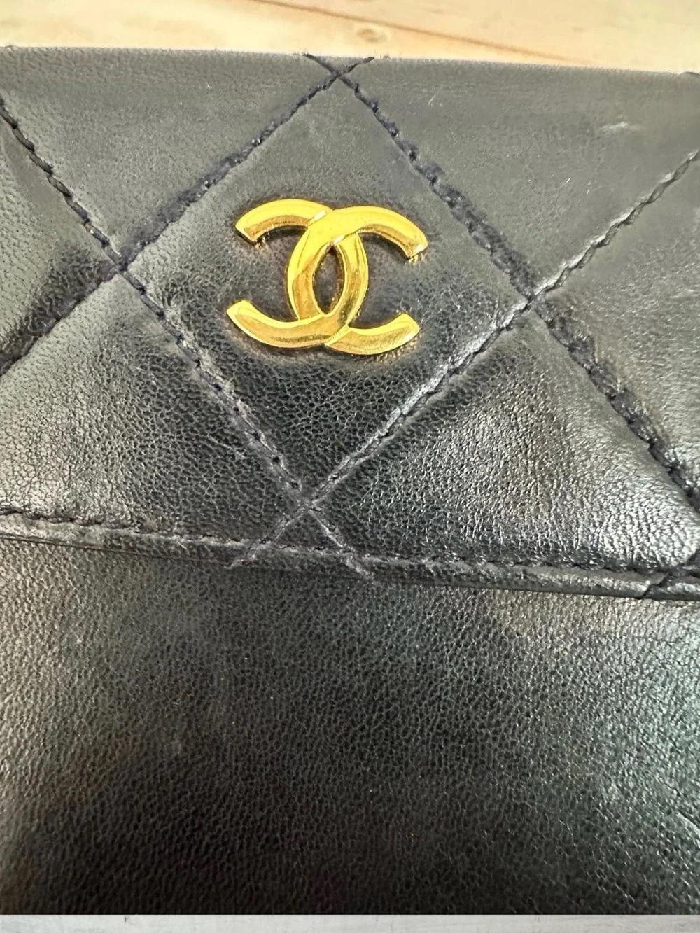 CHANEL Black Quilted Leather Wristlet with Gold CC Emblem